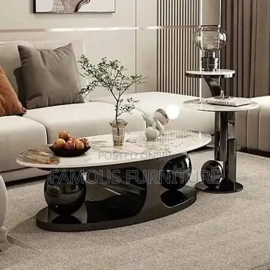 Modern Oval Coffee Table Featuring a Polished Marble-Patterned Top