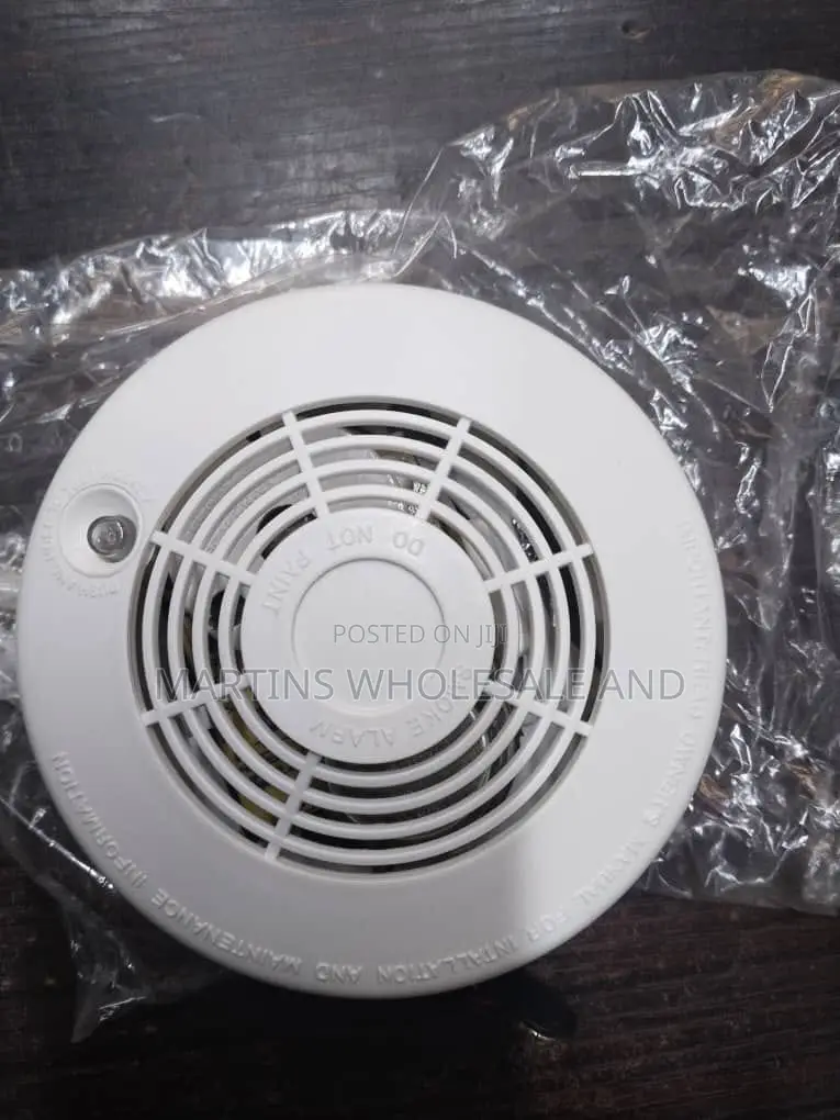 White Battery-Operated Photoelectric Smoke Detector and Alarm Labeled