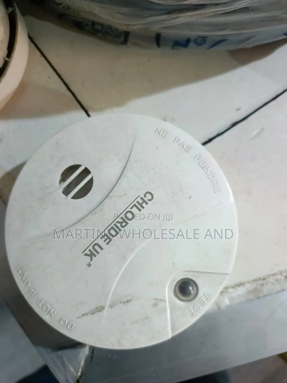 White Battery-Operated Photoelectric Smoke Detector and Alarm Labeled