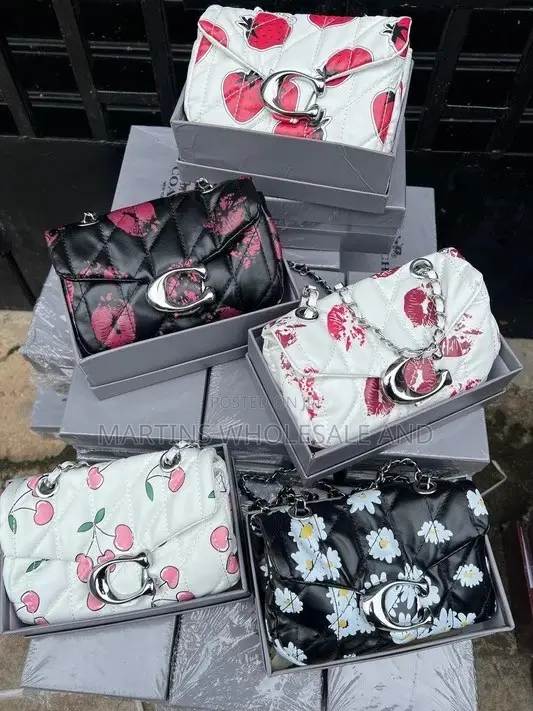 Quilted Patterned Shoulder Bags Styled With the Iconic "C" Clasp Along