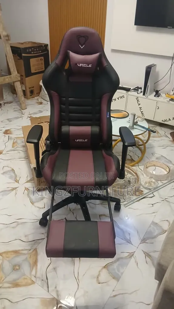 Purple/Black Ergonomic Gaming Chair Featuring a Built-in Footrest