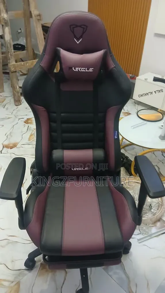 Purple/Black Ergonomic Gaming Chair Featuring a Built-in Footrest