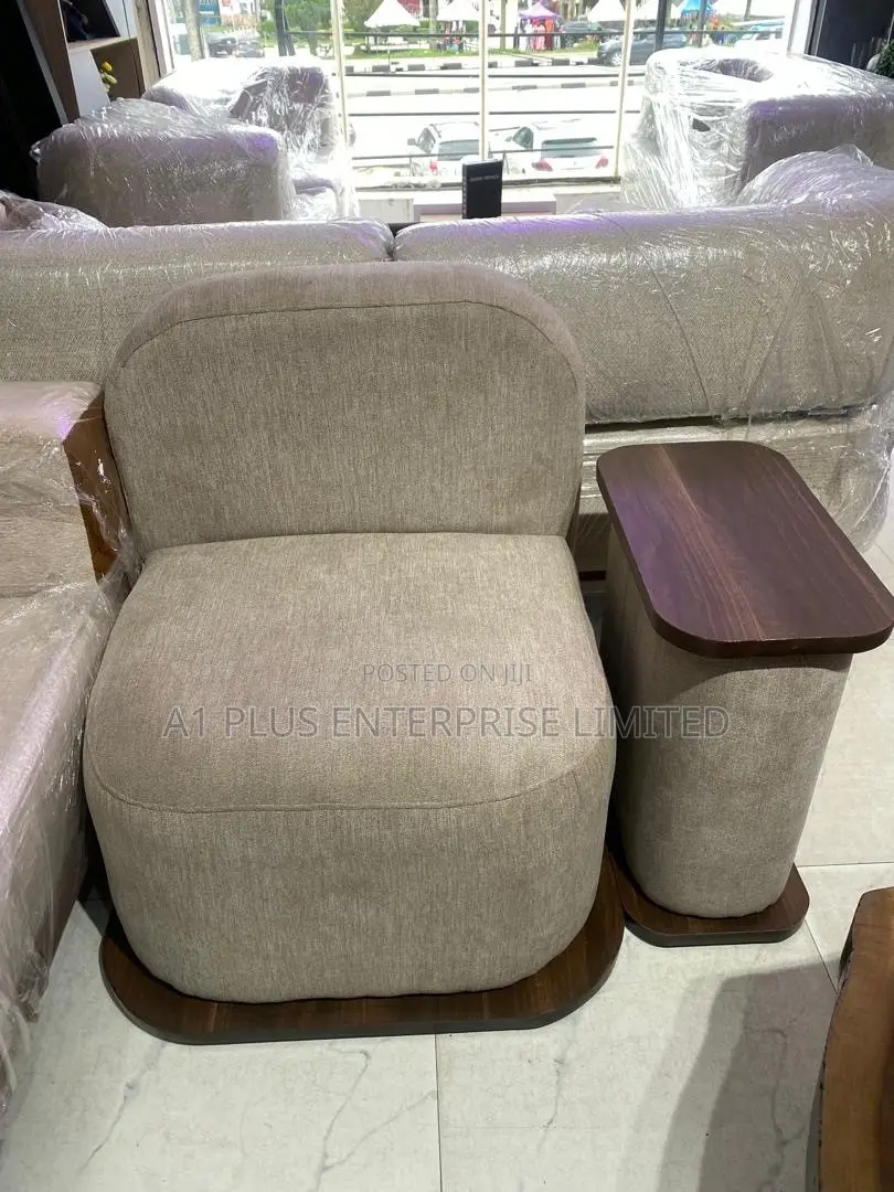 Modern Single Lounge Chair With an Attached Side Table.