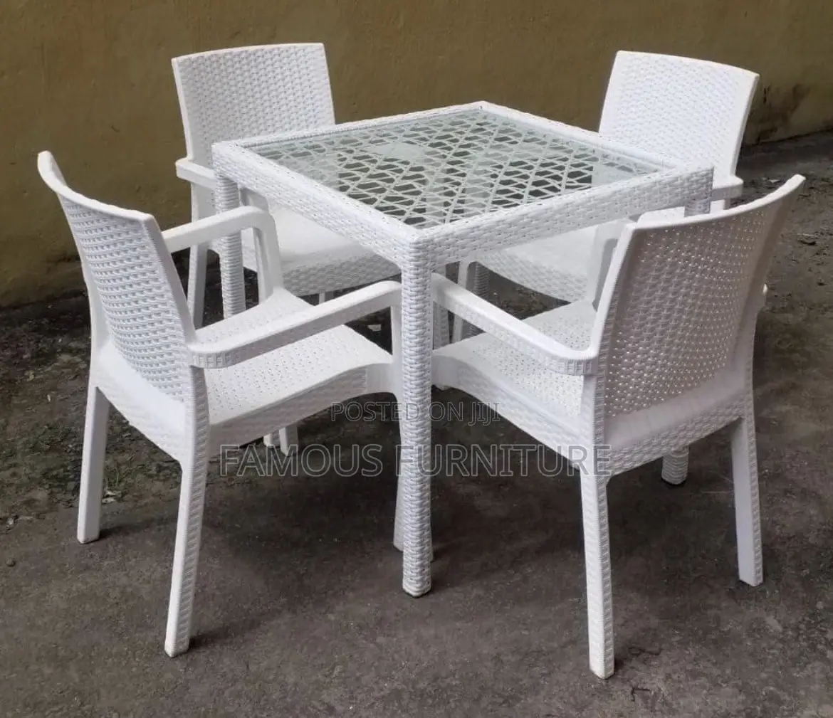 This Appears to Be a Black Rattan-Style Outdoor Dining Set