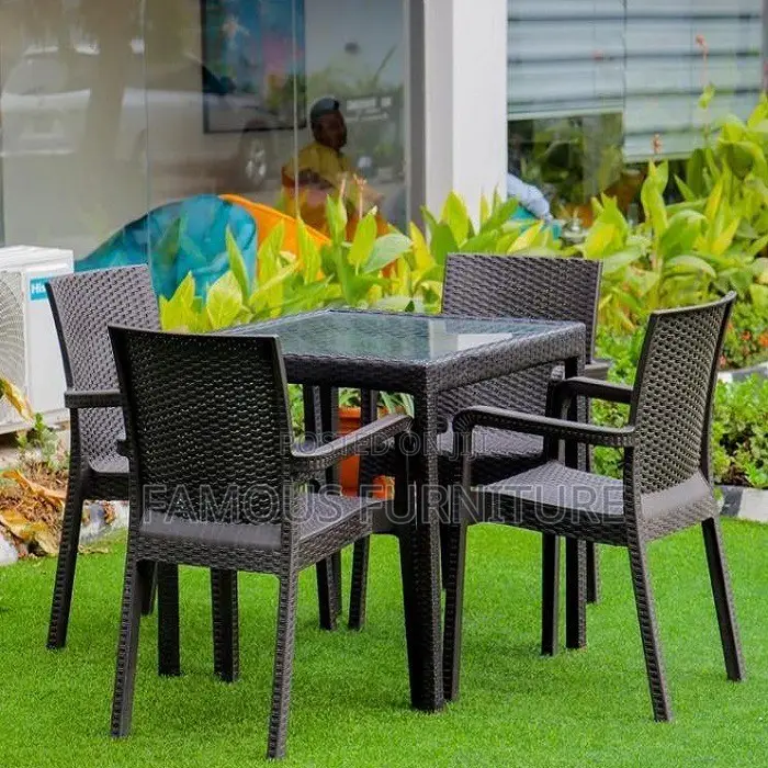 This Appears to Be a Black Rattan-Style Outdoor Dining Set
