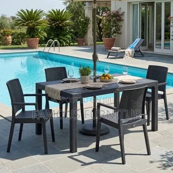 The Image Shows a Black Resin Rattan-Style Outdoor Dining Set