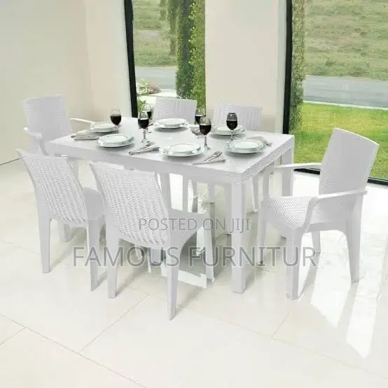 The Image Shows a Black Resin Rattan-Style Outdoor Dining Set