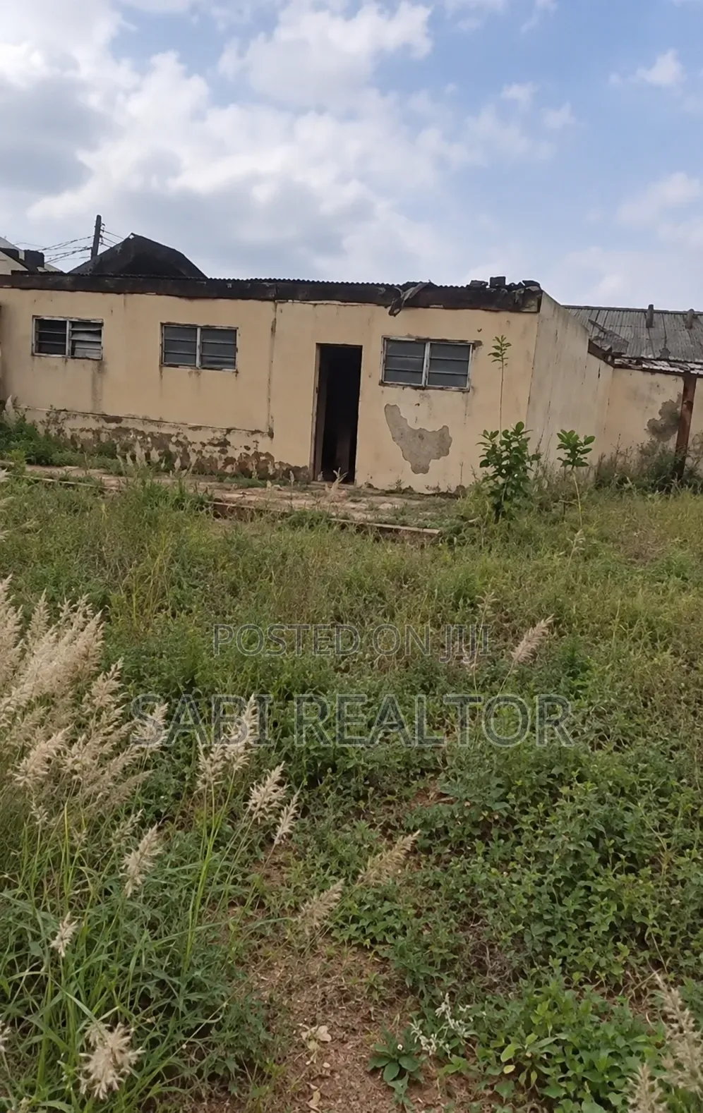Full Plot of Land With 3 Shop at Baruwa Just 3 Houses to the Tarred Rd