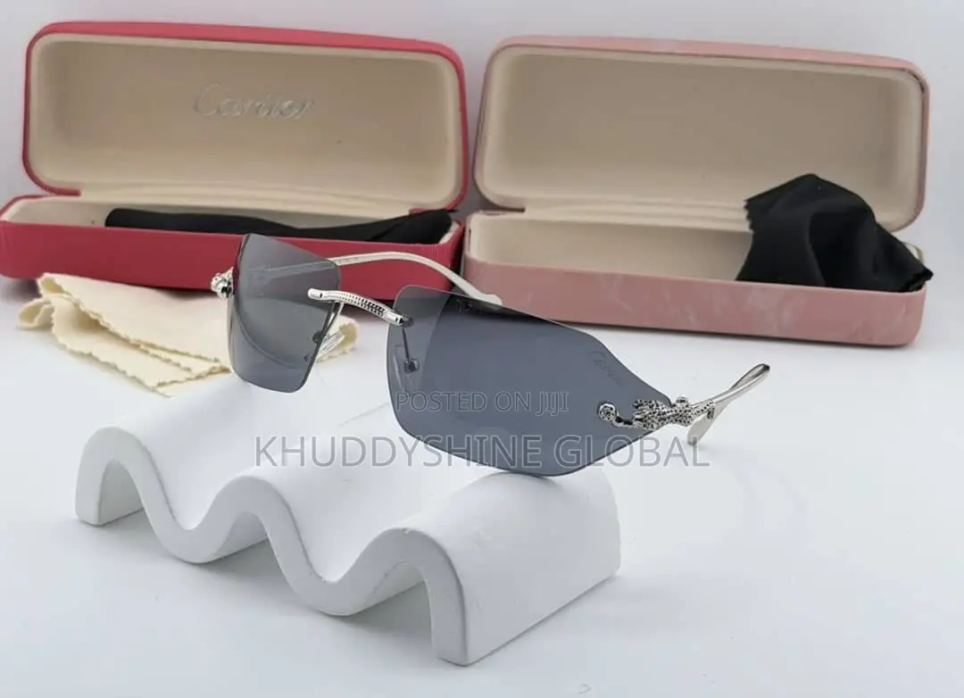 Rimless Luxury Sunglasses Featuring Grey Lenses and Distinct Animal