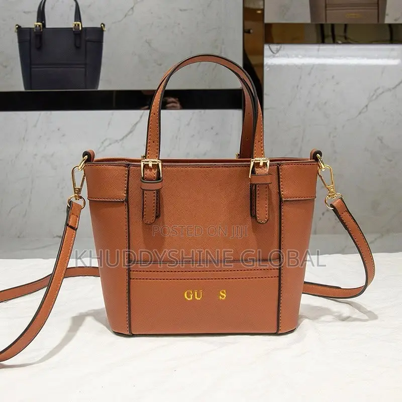 Top-Handle Guess Handbags Feature a Polished Gold-Tone Logo