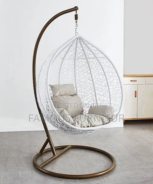 White Teardrop Hanging Egg Chair With an Intricate Woven Basket Design