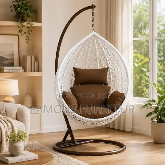 White Teardrop Hanging Egg Chair With an Intricate Woven Basket Design