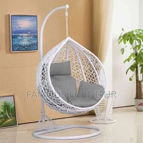 White Teardrop Hanging Egg Chair With an Intricate Woven Basket Design