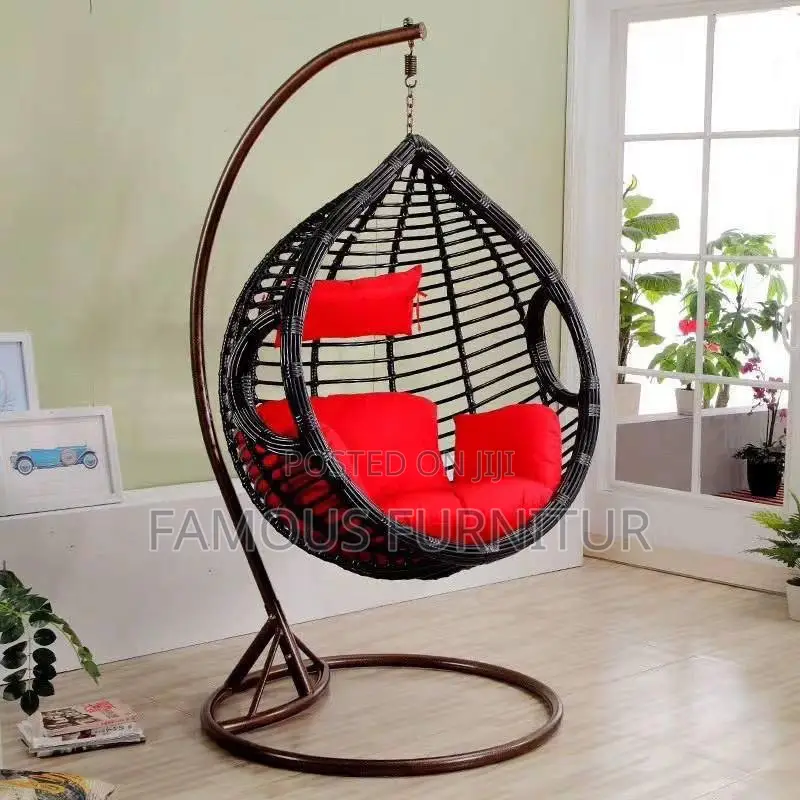 The Image Shows a Black Teardrop-Shaped Hanging Rattan Swing Chair