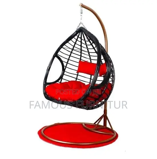 The Image Shows a Black Teardrop-Shaped Hanging Rattan Swing Chair