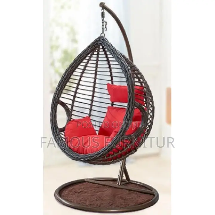 The Image Shows a Black Teardrop-Shaped Hanging Rattan Swing Chair