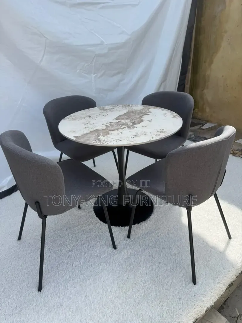 Contemporary Round Dining Set Featuring a Marbled Tabletop