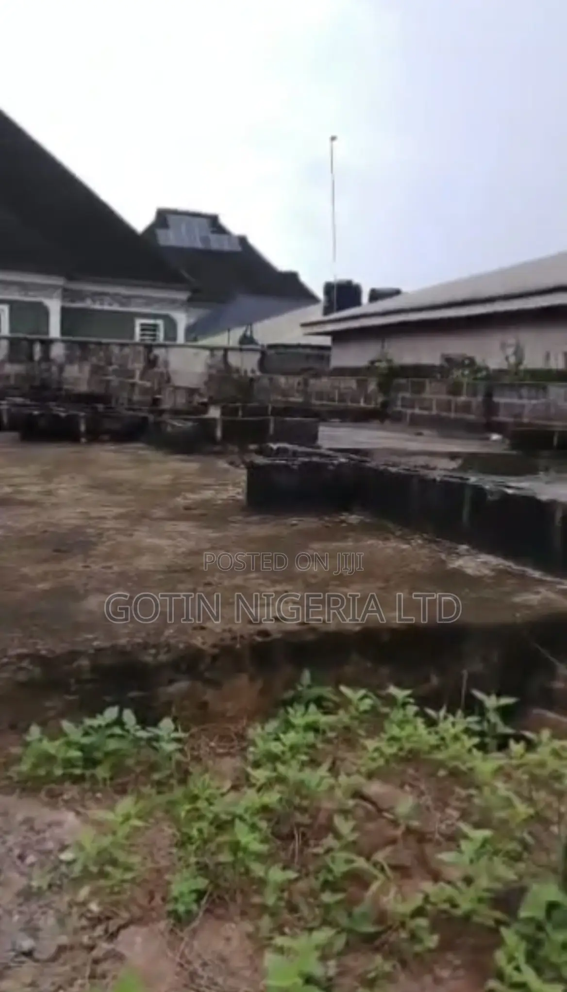 50×100ft Land With Building at DPC Level for Sale