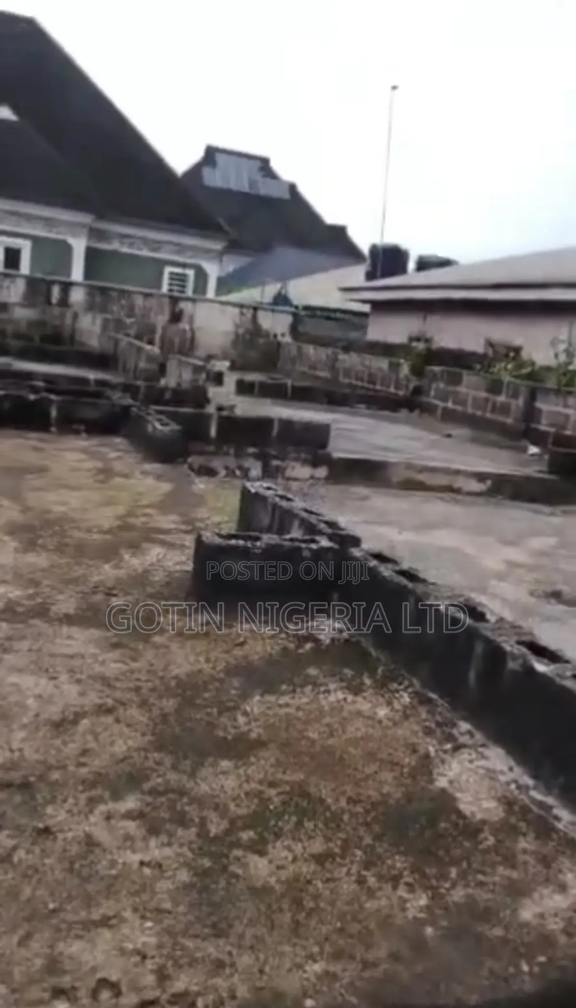 50×100ft Land With Building at DPC Level for Sale