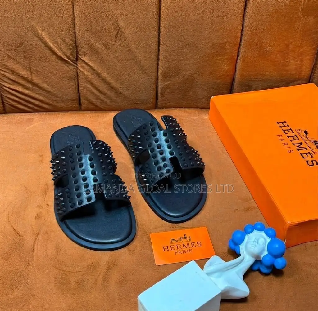 Hermès Spiked "H" Cutout Slide Sandals in Black