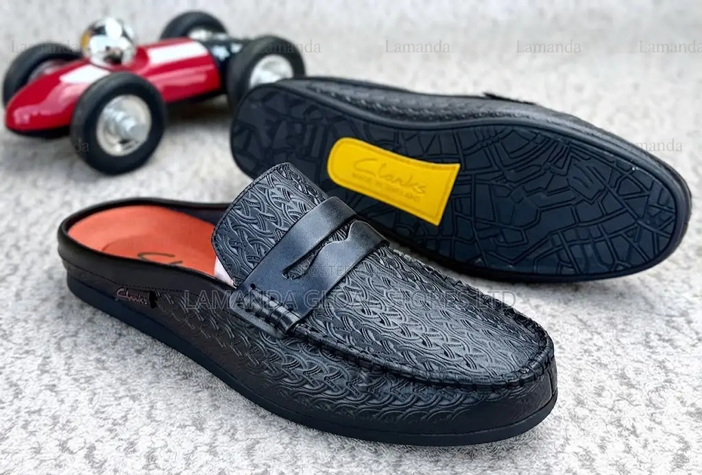 Clarks Embossed Leather Penny Loafer Mules in Black