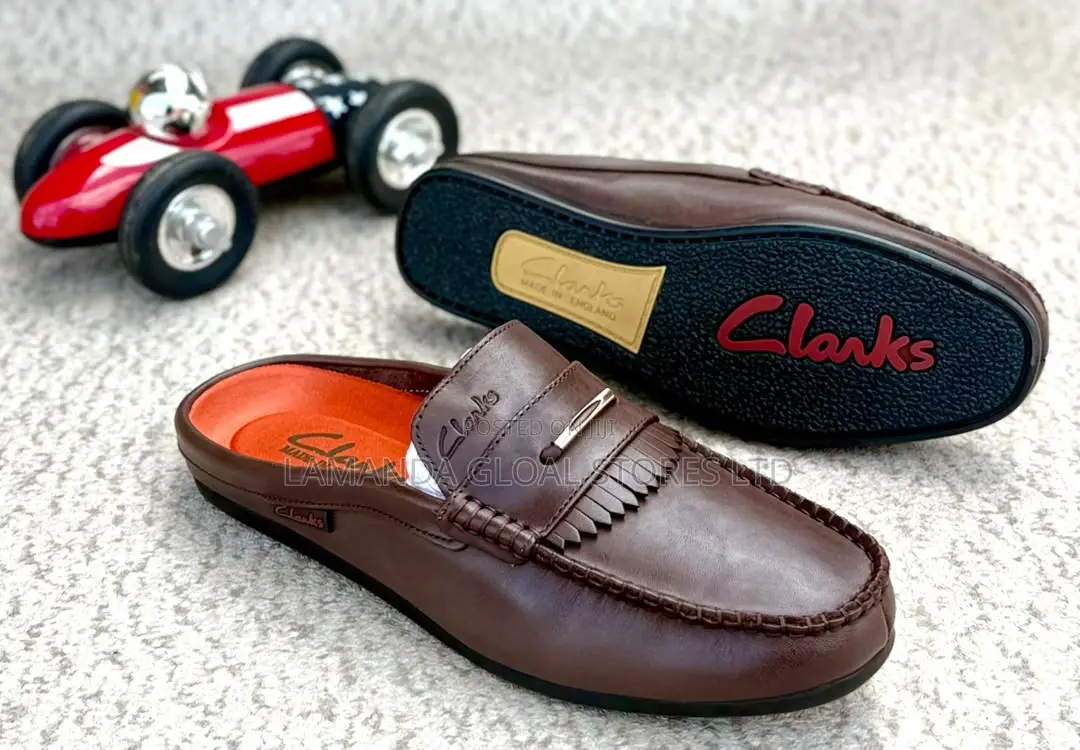 Clarks Leather Kiltie Fringe Slip-on Mules in Brown