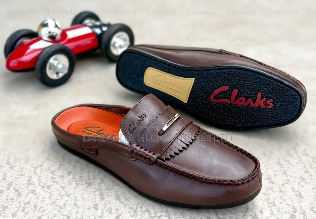 Clarks Leather Kiltie Fringe Slip-on Mules in Brown