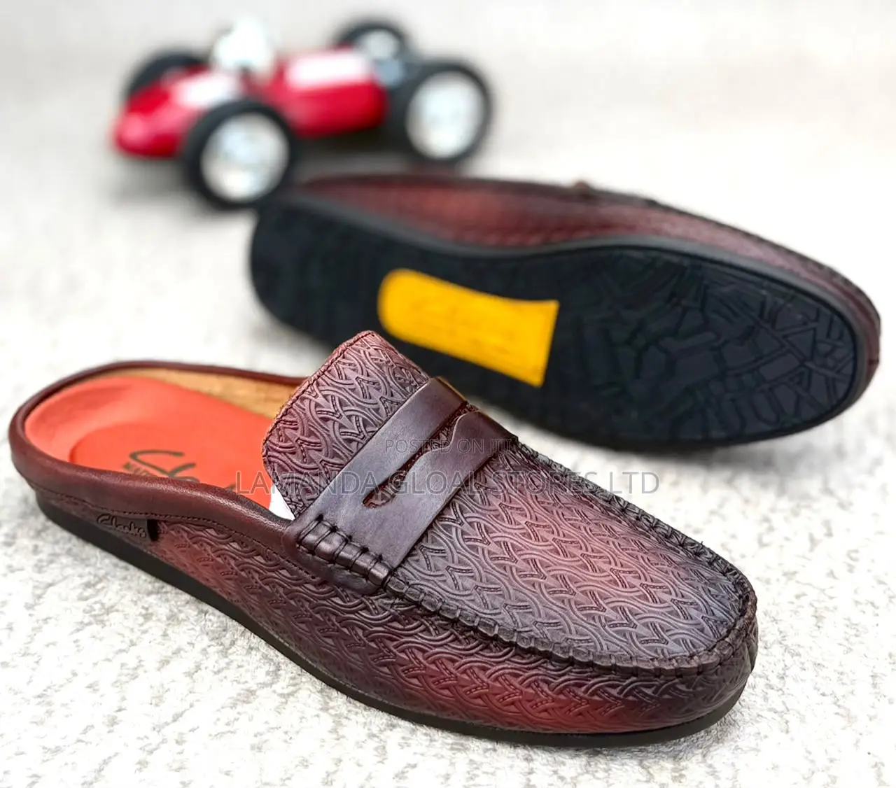 Clarks Embossed Leather Penny Loafer Mules in Brown