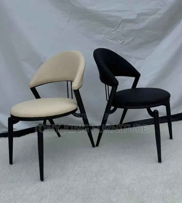 Century Modern Dining Chair Featuring a Cream Faux-Leather Chair