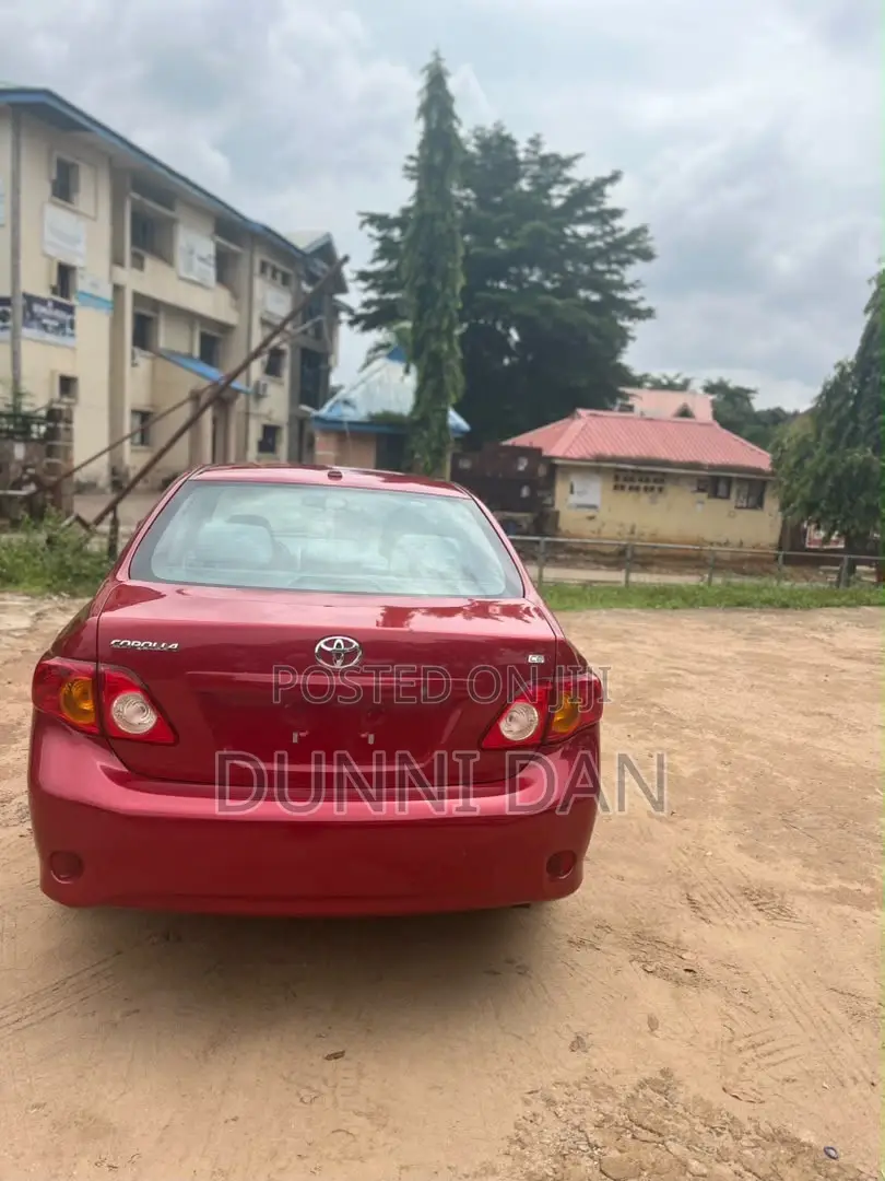Toyota Corolla Base 4dr Sedan (1.8L 4cyl 5M) 2010 Red