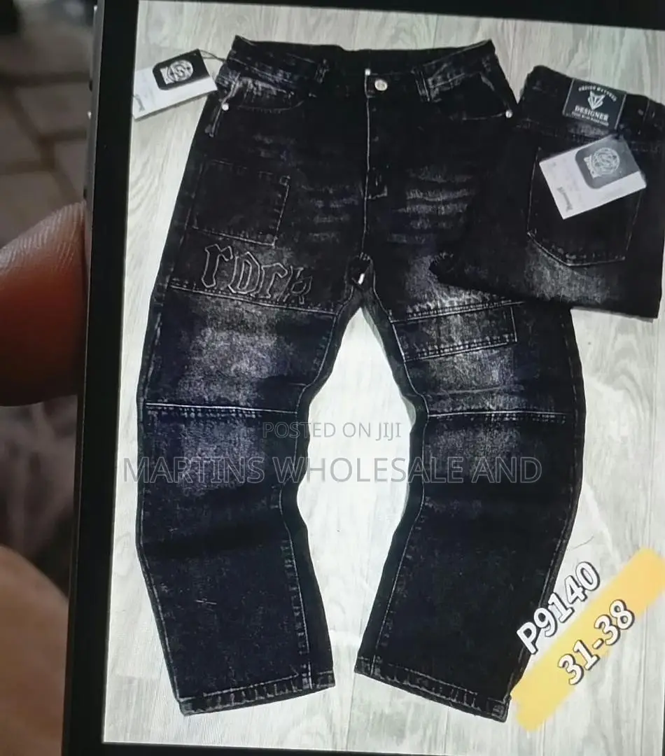 Black Washed Denim Jeans Featuring Paneled Knee Details and Embroider