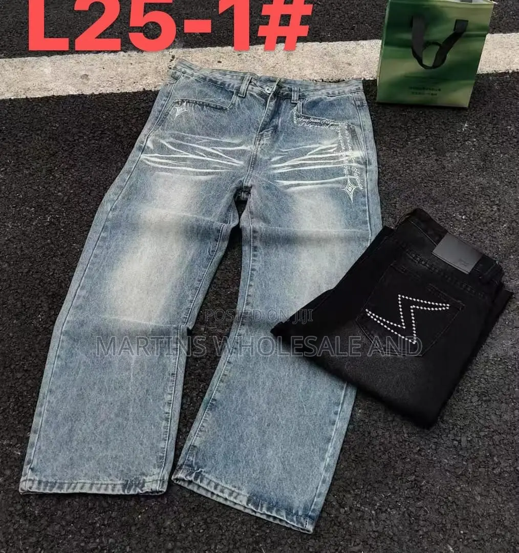 Black Washed Denim Jeans Featuring Paneled Knee Details and Embroider