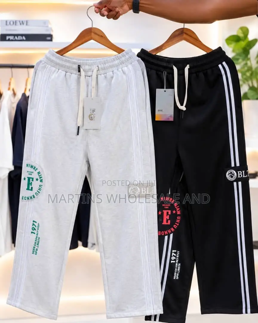 A Pair of Black and Light Grey Colorblock Jogger Pants Featuring