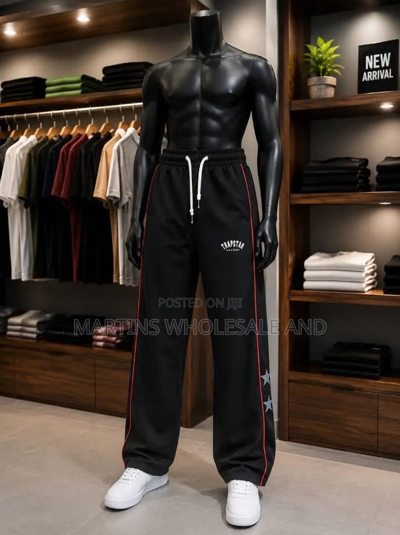 A Pair of Black and Light Grey Colorblock Jogger Pants Featuring