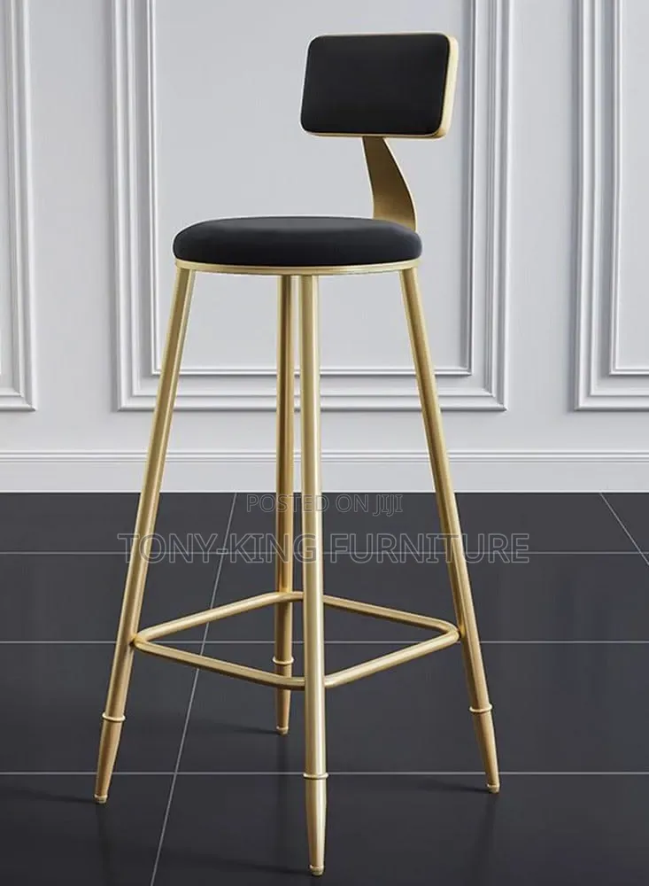 Modern Minimalist Gold Bar Stool Features a Sleek Metallic Frame.