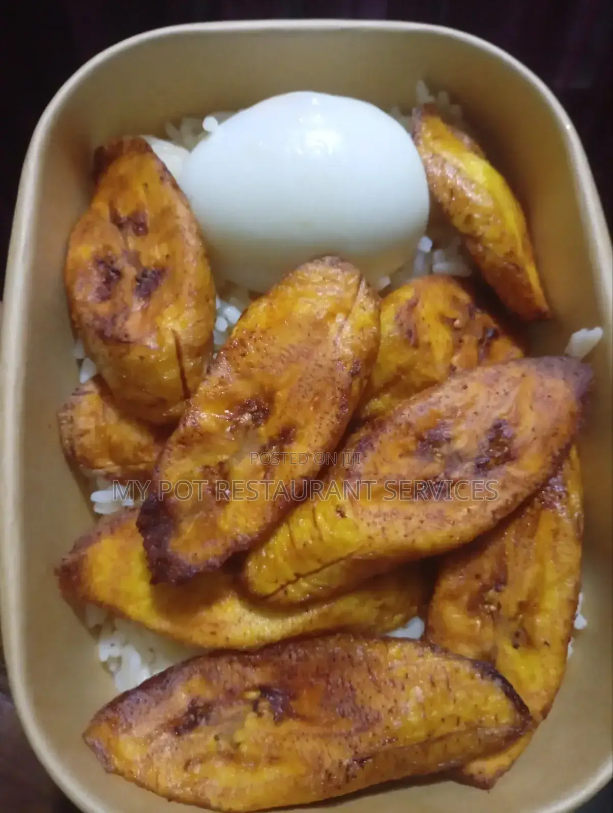 Pack of White Rice Chicken Wings Plantain Egg and Stew