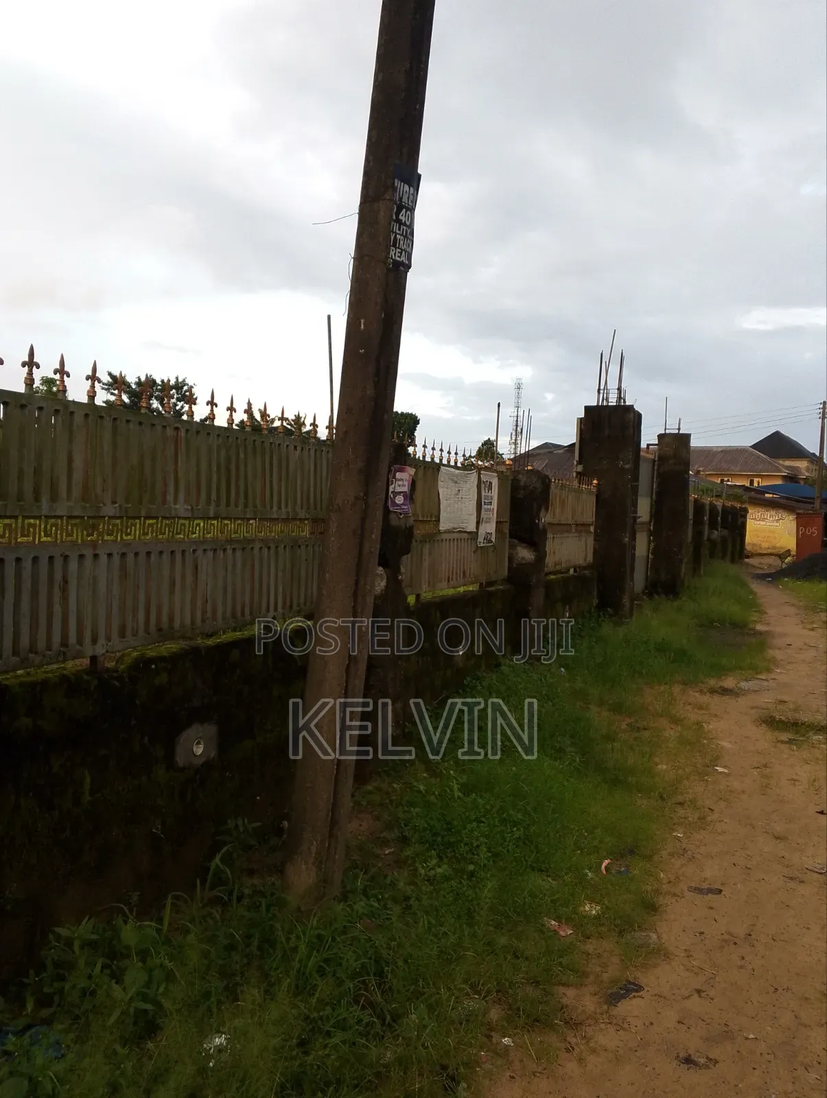Empty Land With a Very High Fence