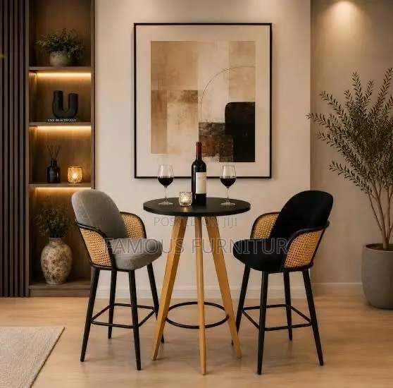 Modern Pub Set With a Round Black Table and Two Woven Rattan