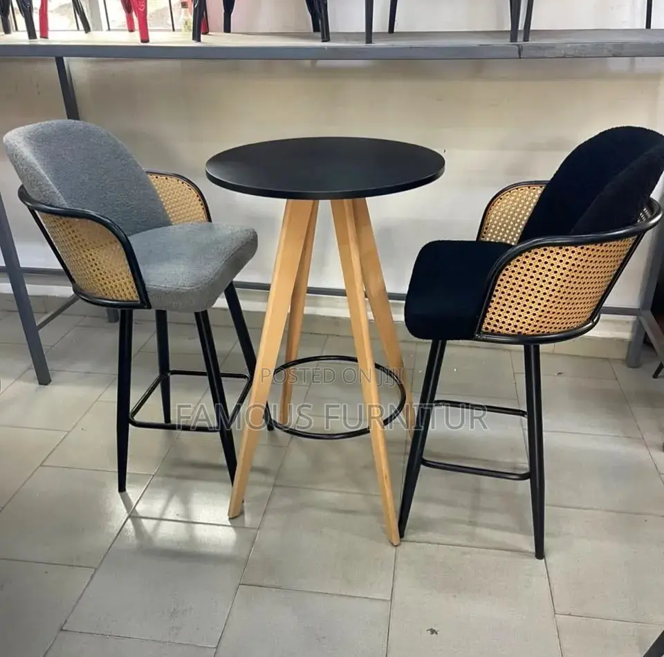 Modern Pub Set With a Round Black Table and Two Woven Rattan