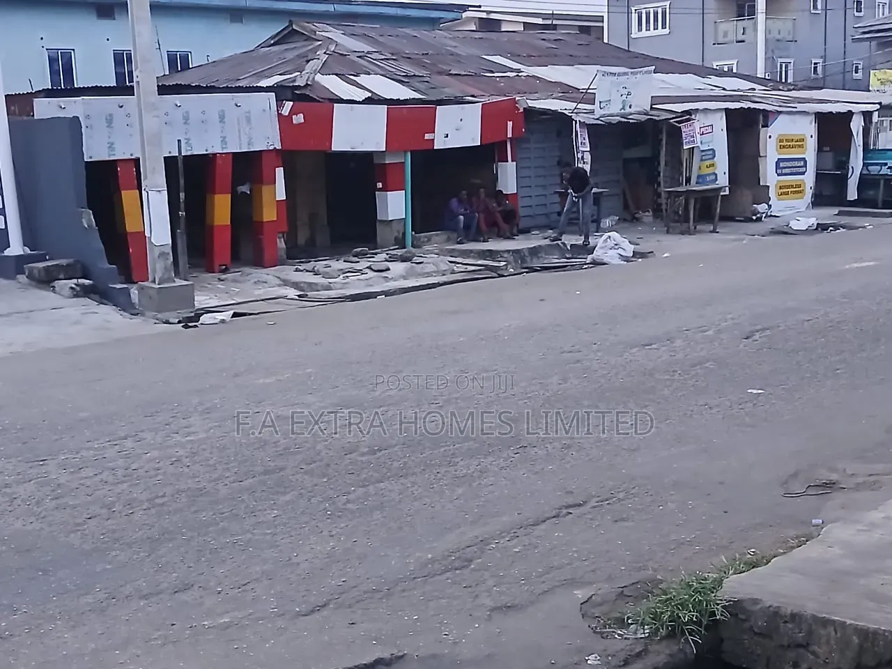 A Bungalow, Consist of Rooms and (8 Units) of Shops, on a Corner Piece