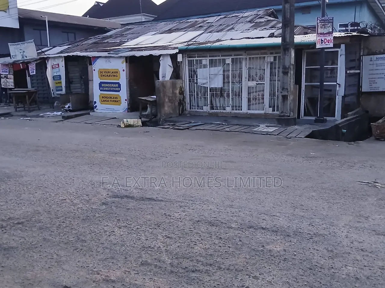 A Bungalow, Consist of Rooms and (8 Units) of Shops, on a Corner Piece
