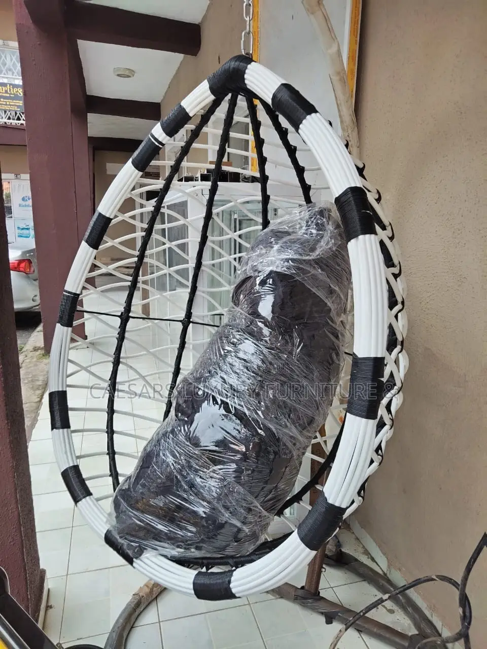 White and Black Hanging Swing Chair With Stand