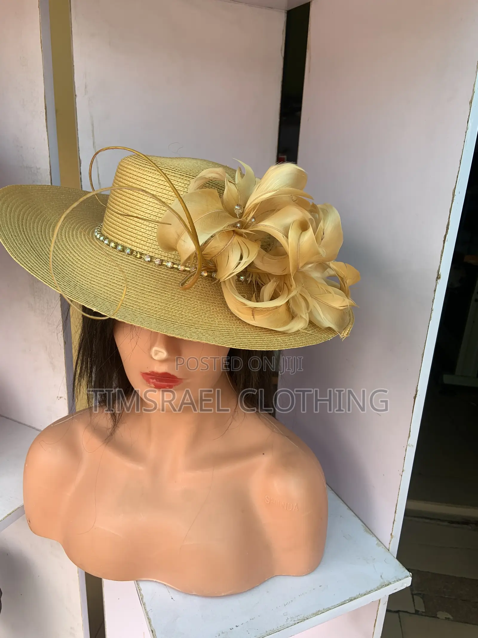Gold Hat With Feather Decoration
