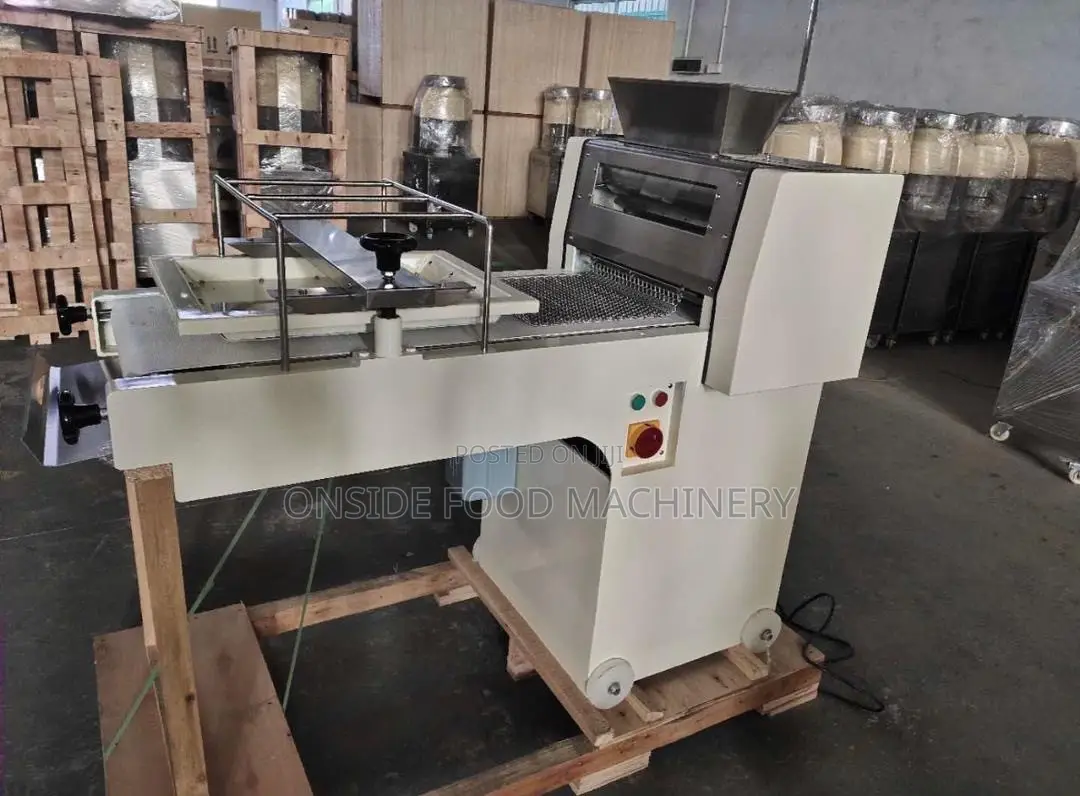 A Dough Moulder Is a Bakery Machine Used to Shape and Roll Dough