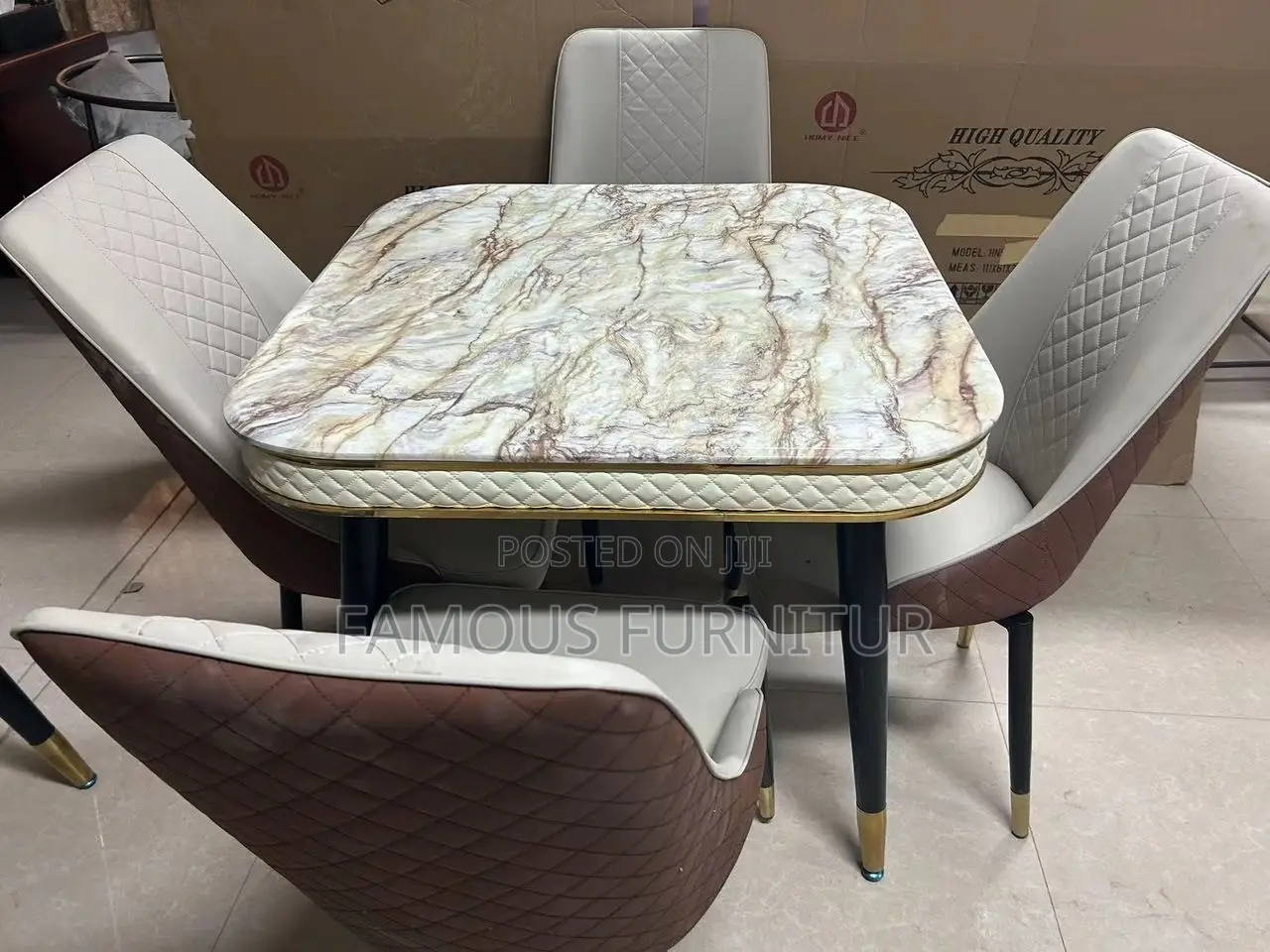 This Round Marble Dining Set Features a White Marble-Top Table