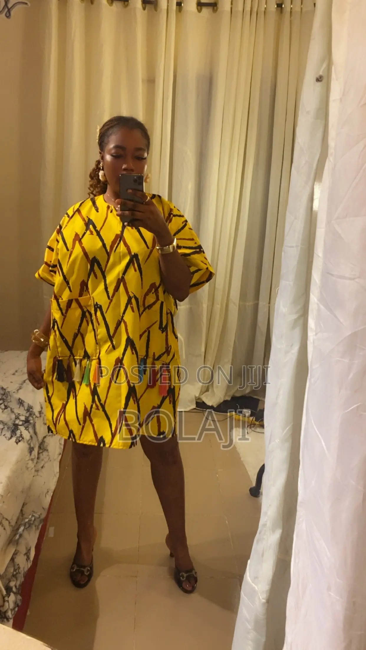 A Knee Length Ankara Dress With Tassels