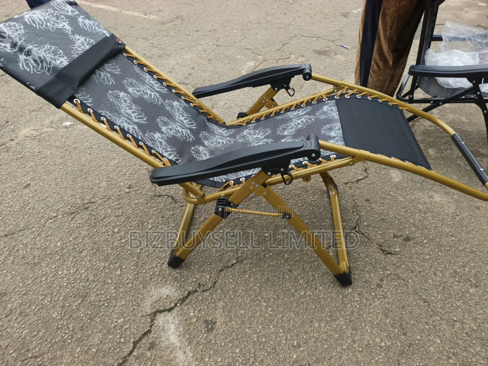 Foldable Outdoor Zero-Gravity Reclining Lounge Chair With a Gold-Toned