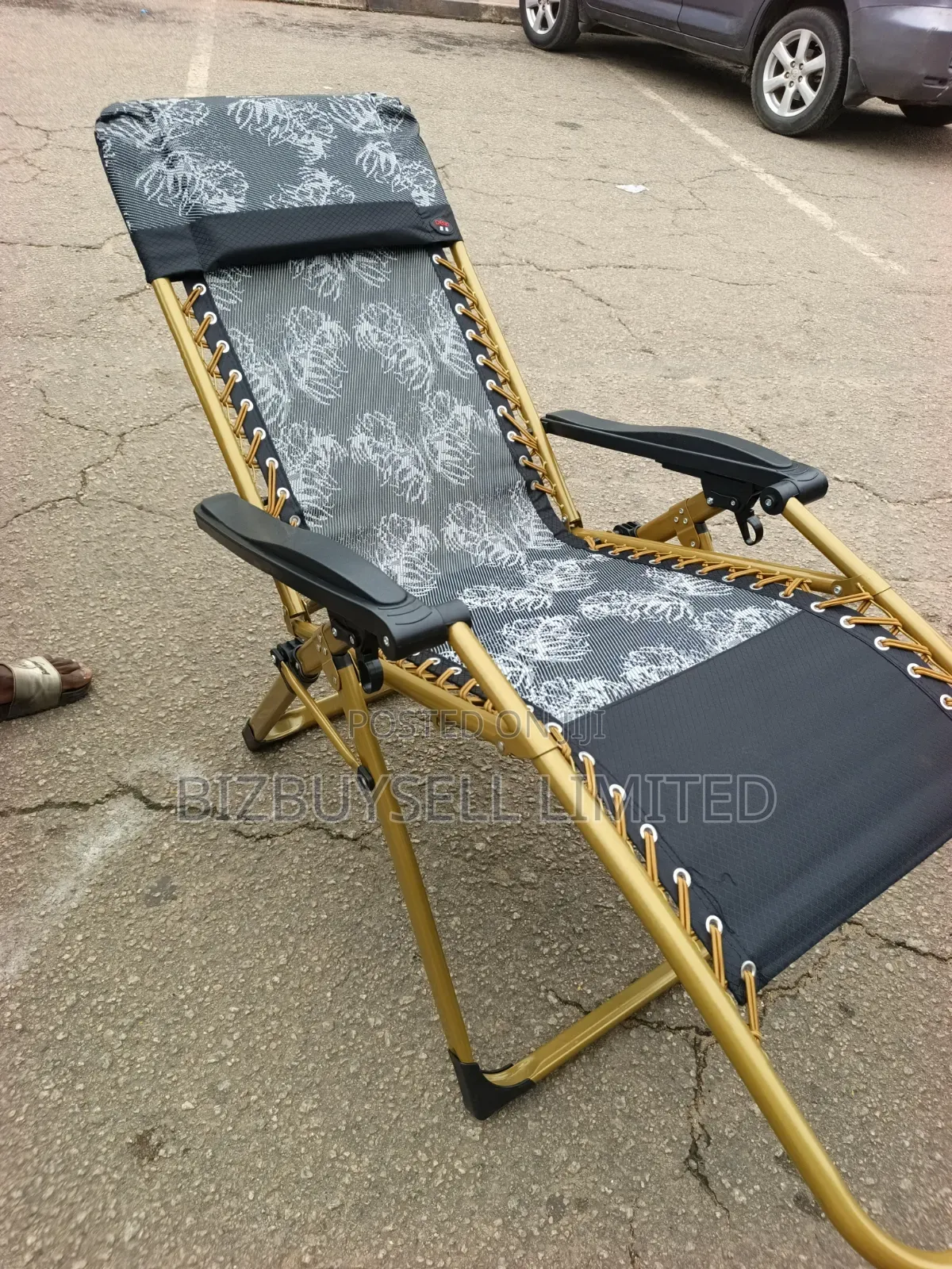 Foldable Outdoor Zero-Gravity Reclining Lounge Chair With a Gold-Toned