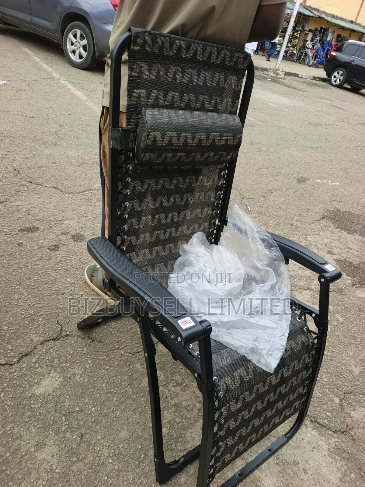 Folding Outdoor Relaxing Lounge Chair With a Patterned Mesh Fabric.