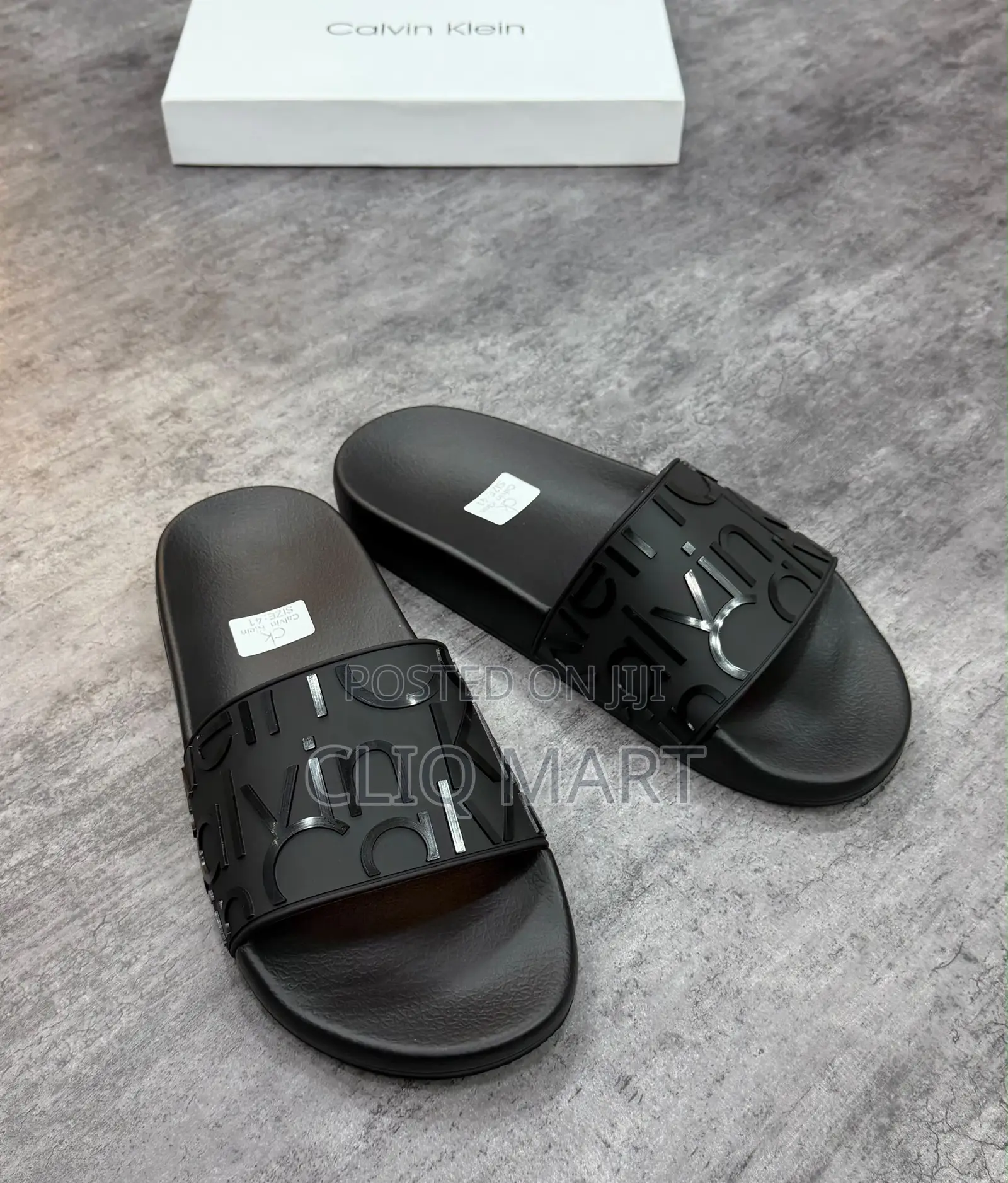 Calvin Klein Embossed Logo Slider Sandals | Black & Transparent